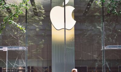 man passing an apple store